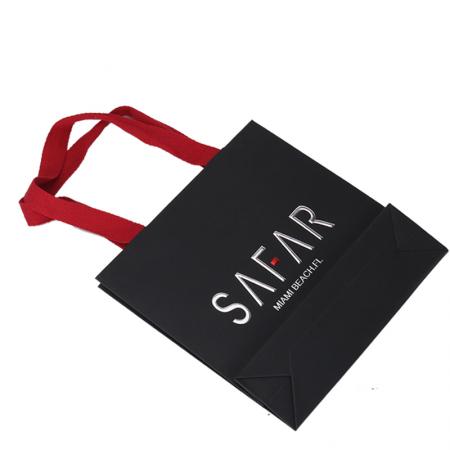 Personality custom printed black luxury brand retail shopping packaging clothing paper bag with red handle
