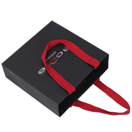 Personality custom printed black luxury brand retail shopping packaging clothing paper bag with red handle