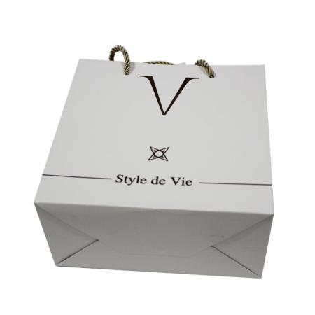 Shopping gold paper gift bag with logo design