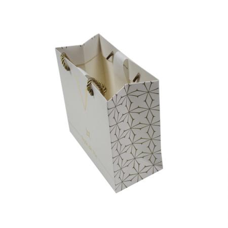 Shopping gold paper gift bag with logo design